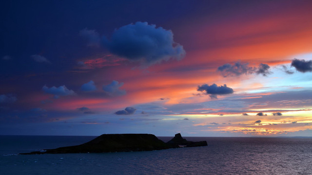 Sunset island ocean clouds boat free wallpaper - medium preview image