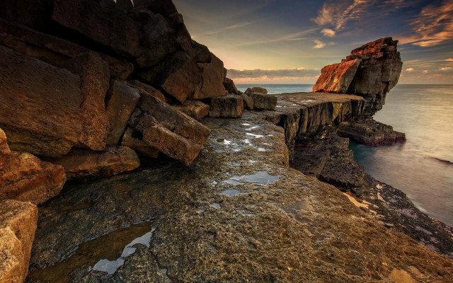Rocky cliff water bench cloudscape free wallpaper - medium preview image