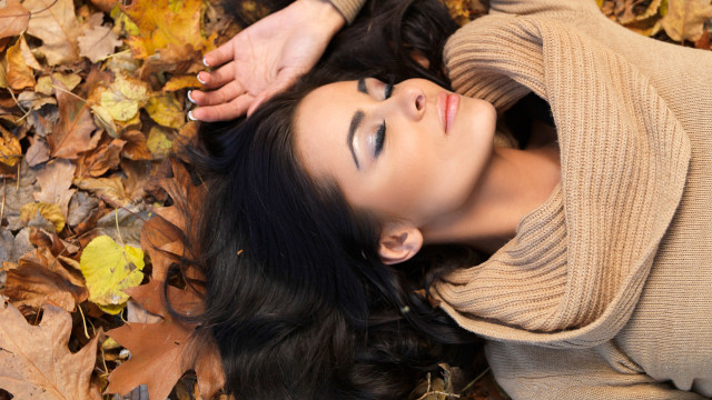 Woman lying autumn leaves nature free wallpaper - medium preview image