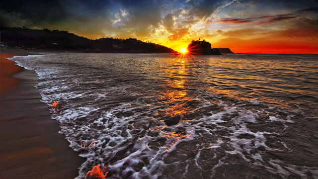 Sunset beach waves mountain clouds free wallpaper - medium preview image