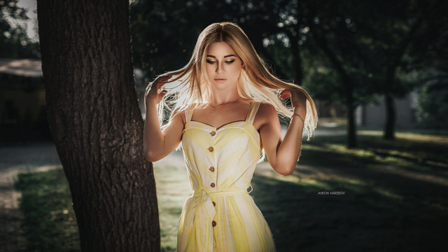 Woman yellow dress tree serious free wallpaper - medium preview image