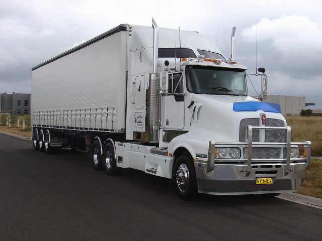 Semi truck field building sky free wallpaper - medium preview image