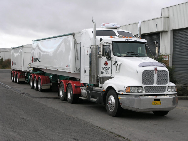 Semi truck parked warehouse cloudy free wallpaper - medium preview image