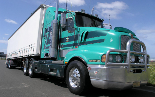 Green semi truck road grass free wallpaper - medium preview image