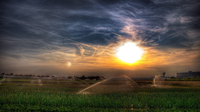 Sunset field sprinkler water landscape free wallpaper - medium preview image