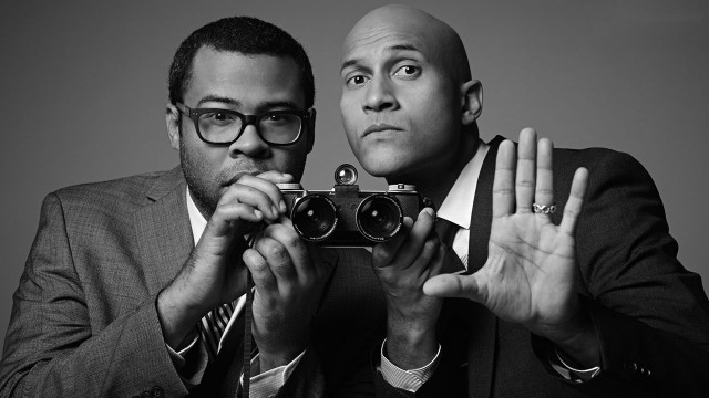Men suits holding camera posing free wallpaper - medium preview image