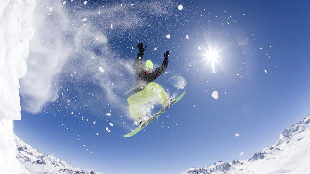 Snowboarder midair sunny mountains snowflakes free wallpaper - medium preview image