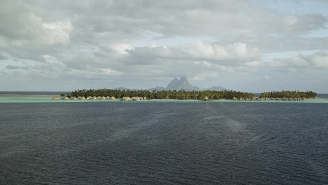 Small island houses mountain ocean free wallpaper - medium preview image