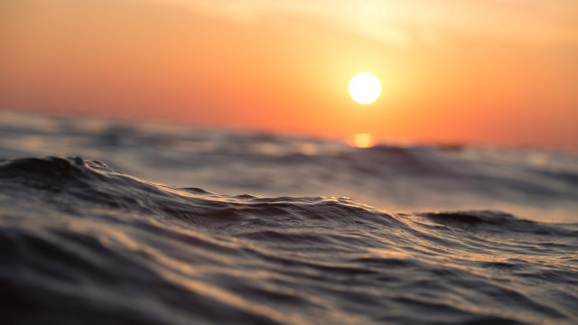 Sunset ocean waves boat cloudy free wallpaper - medium preview image