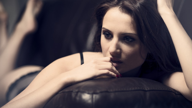 Woman couch portrait blackhair blurry free wallpaper - medium preview image
