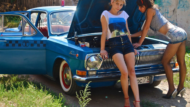 Two women car park bicycle free wallpaper - medium preview image