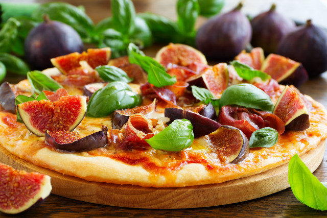 Pizza olives cheese woodenboard greenleaves free wallpaper - medium preview image