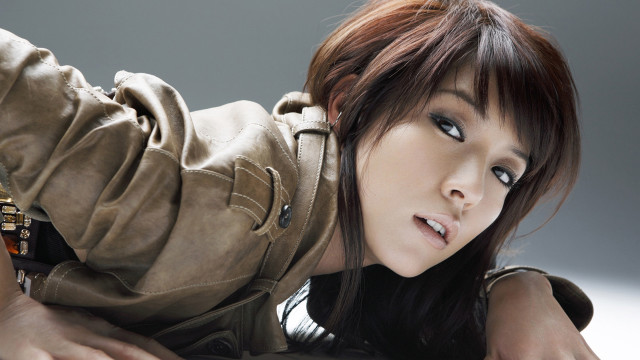 Woman brown jacket brown purse free wallpaper - medium preview image