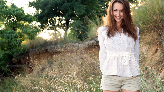 Woman field frisbee smiling trees free wallpaper - medium preview image