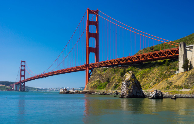 Bridge cliffside building beach boat free wallpaper - medium preview image