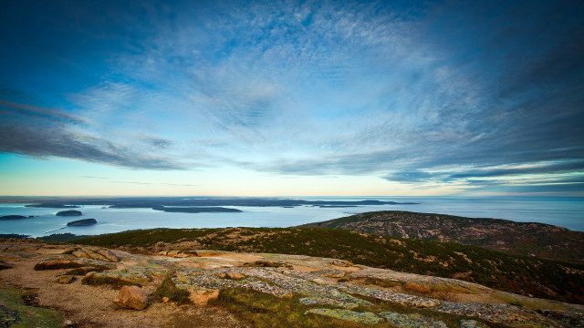 Hill overlooking water mountains cloudy free wallpaper - medium preview image