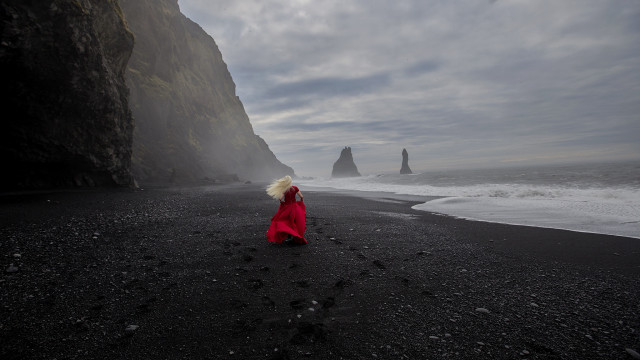 Beach red coat cliff ocean free wallpaper - medium preview image