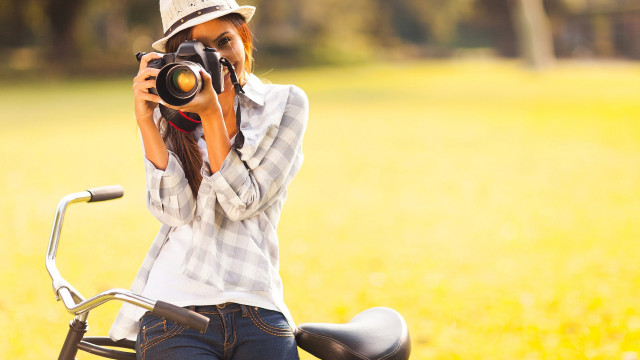 Woman biking self portrait field #2 free wallpaper - medium preview image