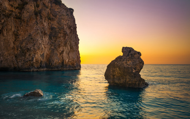 Ocean sunset rocks foreground beach free wallpaper - medium preview image