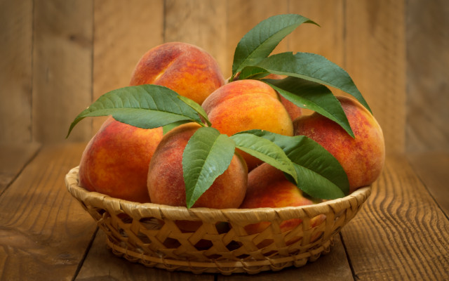Basket peaches leaves wooden table free wallpaper - medium preview image