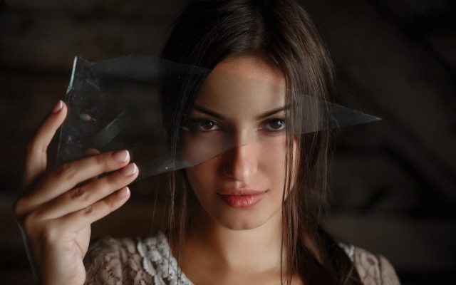Woman holding plastic serious look free wallpaper for desktop - medium preview image