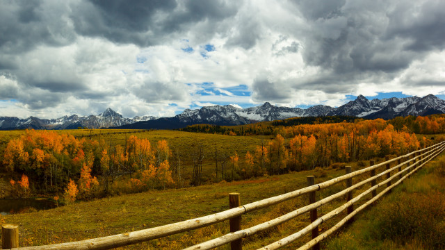 Wooden fence mountains clouds grassy free wallpaper - medium preview image