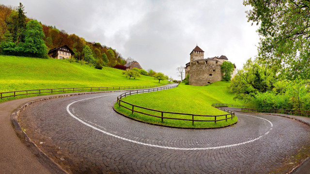Winding road stone building fence free wallpaper - medium preview image