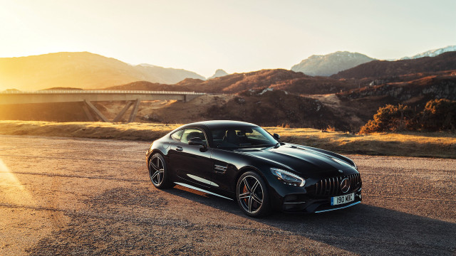 Black sports car bridge mountains free wallpaper - medium preview image