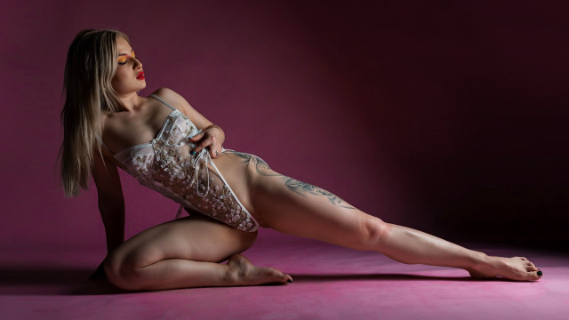 Tattooed woman pink floor arabesque free wallpaper - medium preview image