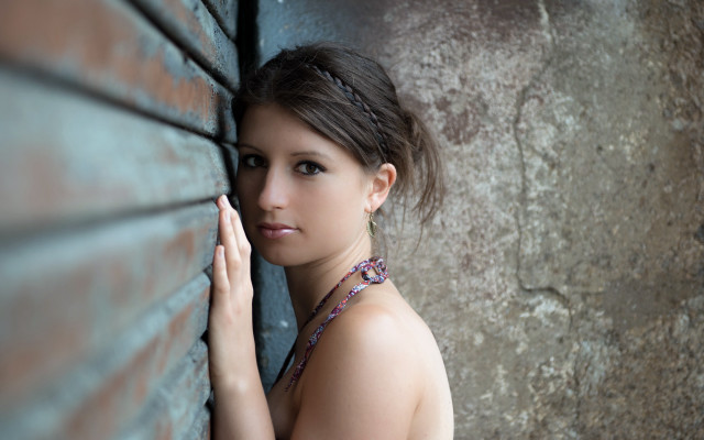 Woman brick wall portrait blurry free wallpaper - medium preview image