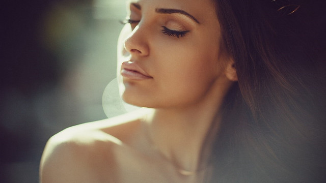 Woman longhair necklace looking down free wallpaper - medium preview image