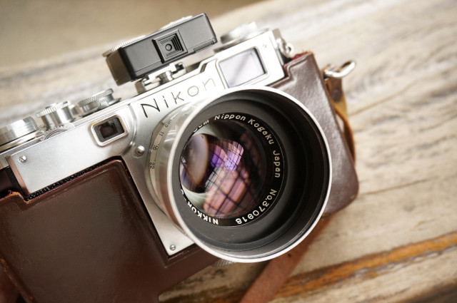 Camera leather case wooden table free wallpaper - medium preview image