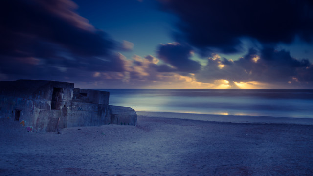 Beach building sunset clouds water free wallpaper - medium preview image
