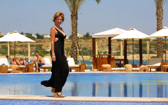 Woman black dress pool umbrellas free wallpaper - medium preview image