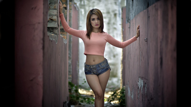 Woman pink shirt shorts alleyoutstretched free wallpaper - medium preview image