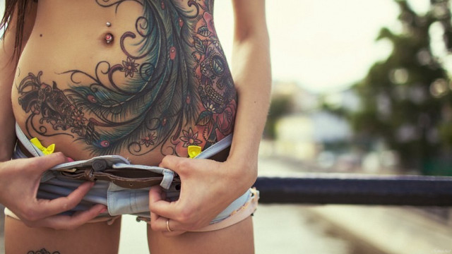 Woman tattoo wallet balcony blurry free wallpaper - medium preview image