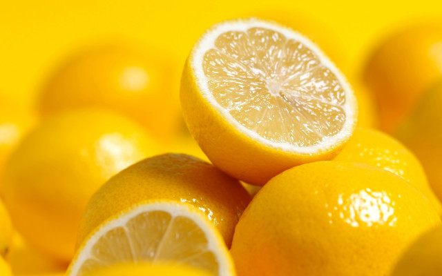Lemons pile yellow surface cut free wallpaper - medium preview image