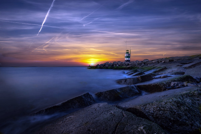 Lighthouse rocky shore sunset contrails free wallpaper - medium preview image