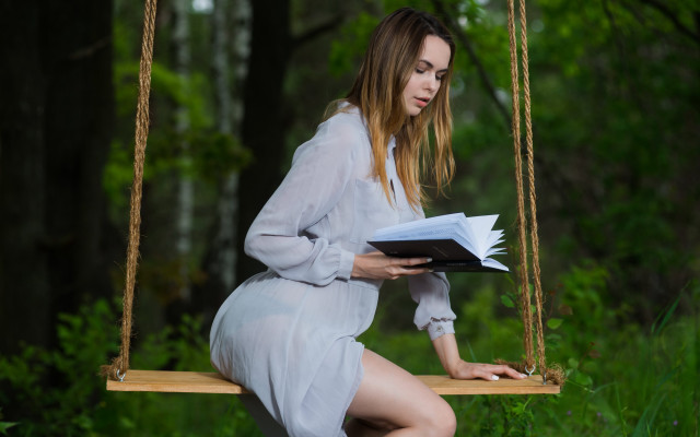 Woman white dress swing reading free wallpaper - medium preview image