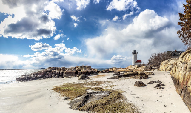 Lighthouse rocky shore cloudy sky free wallpaper - medium preview image