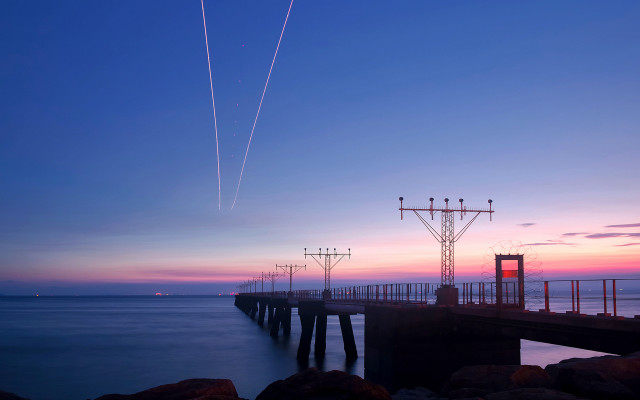 Pier plane sunset contrails water #3 free wallpaper - medium preview image