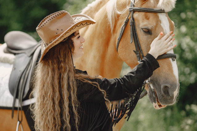 Woman cowboy hat horse blurry free wallpaper - medium preview image