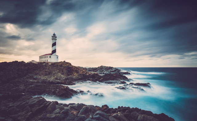 Lighthouse rocky shore cityscape sunset free wallpaper - medium preview image