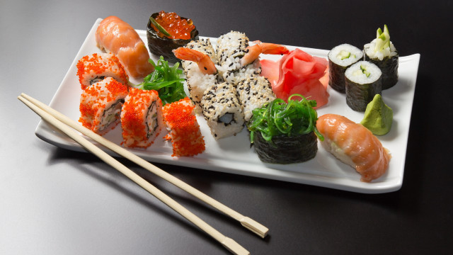 Sushi plate chopsticks black table free wallpaper - medium preview image