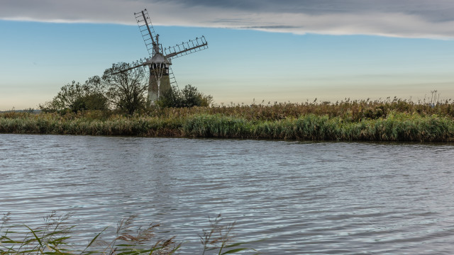 Windmill island river grass clouds free wallpaper - medium preview image