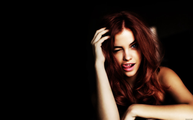 Redhead woman posing dark hands free wallpaper - medium preview image