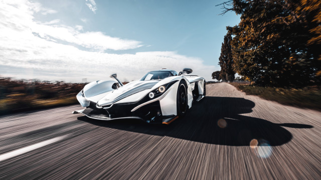 White sports car driving forest #2 free wallpaper - medium preview image