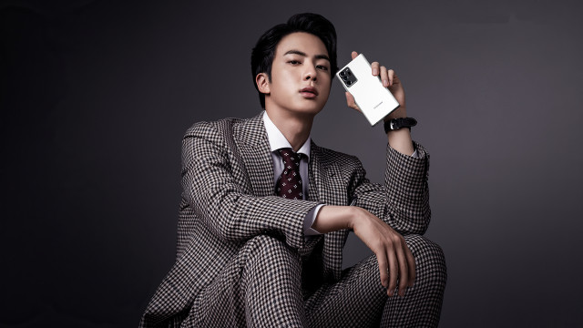 Man suit cellphone sitting fishnets free wallpaper - medium preview image