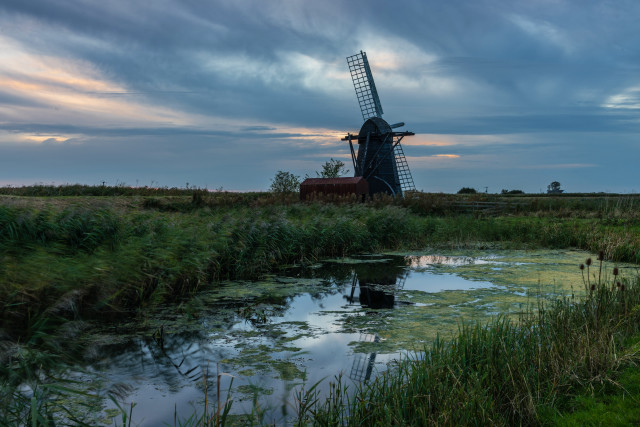 Windmill pond grass cloudy sky free wallpaper - medium preview image