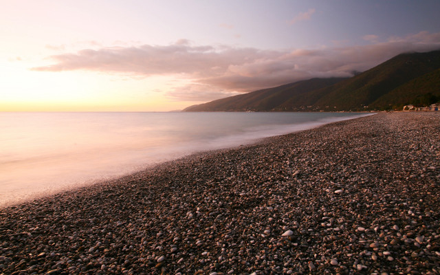 Beach rocks mountain water sunset free wallpaper for desktop - medium preview image